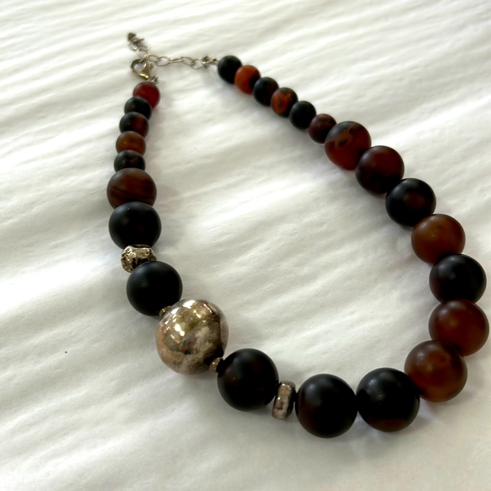 Multi brown, heavy beaded necklace with hammered silver Accent, 2 inch clasp